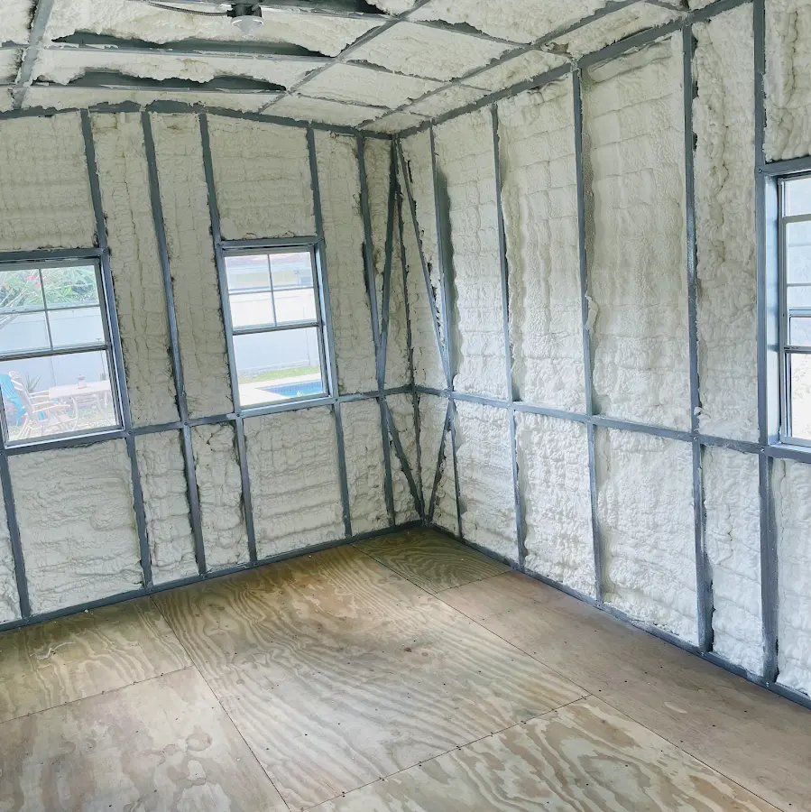 Closed-cell spray foam insulation applied to wall cavities in a residential project in Belvidere